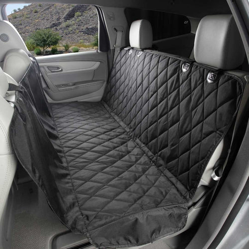 Black waterproof hammock-style dog car seat cover installed across a car back seat